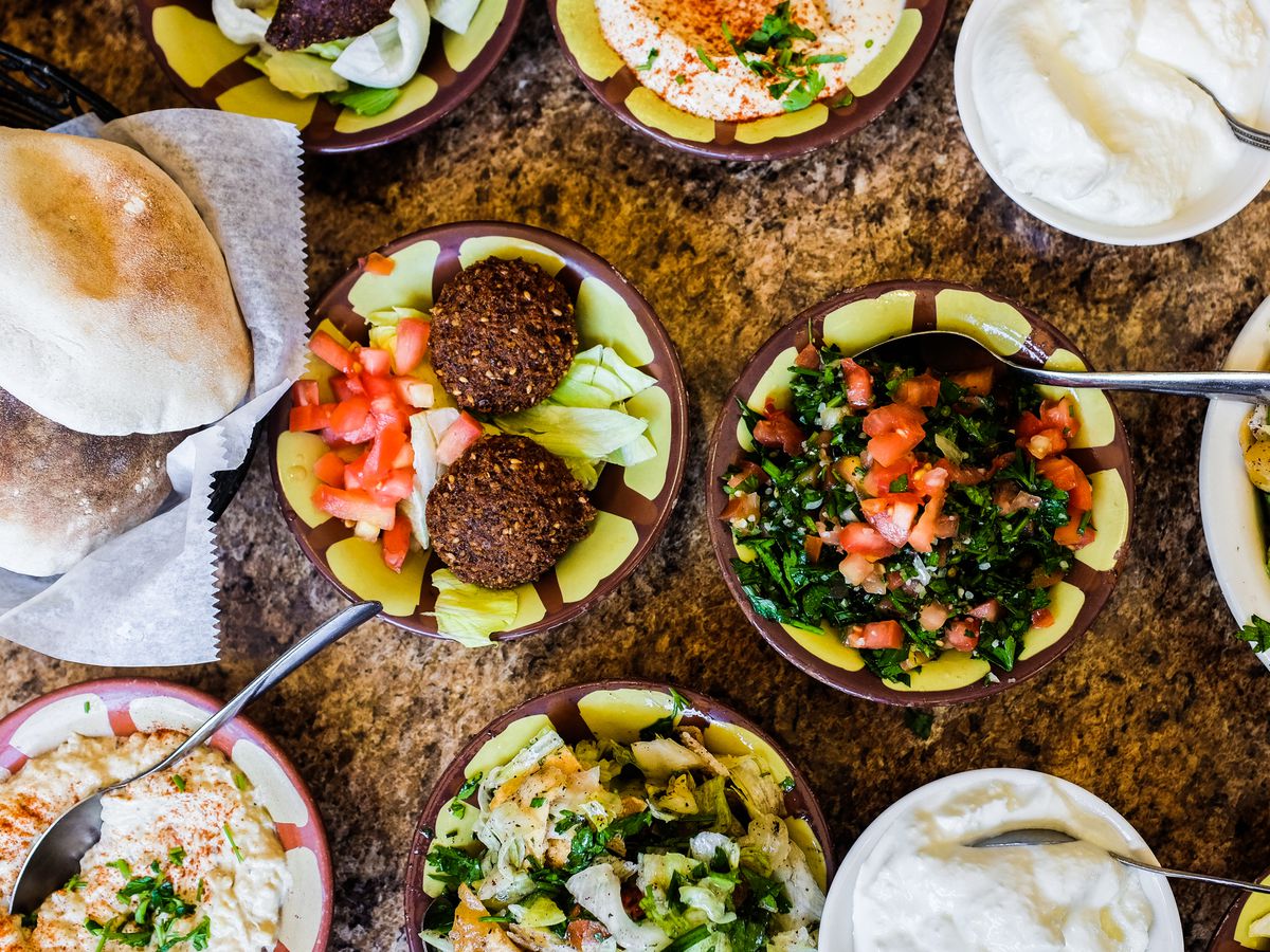 Several traditional Lebanese dishes served at Al-Ameer in Dearborn set on a stone countertop