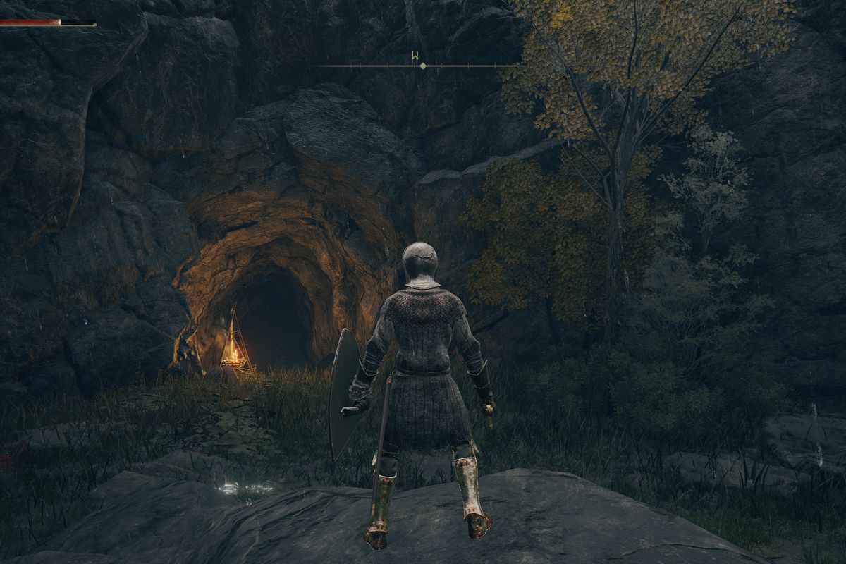 Standing at the entrance to Tombsward Cave in Elden Ring