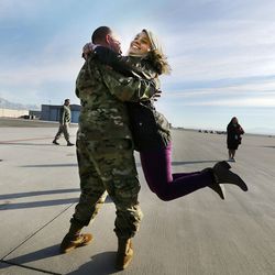 CW2 Gist Wylie swings his daughter Rachel as soldiers from Detachment 2, 101st Airborne Division (Air Assault) return to Utah on Friday, Nov. 18, 2016, following an 11-month deployment to Iraq.