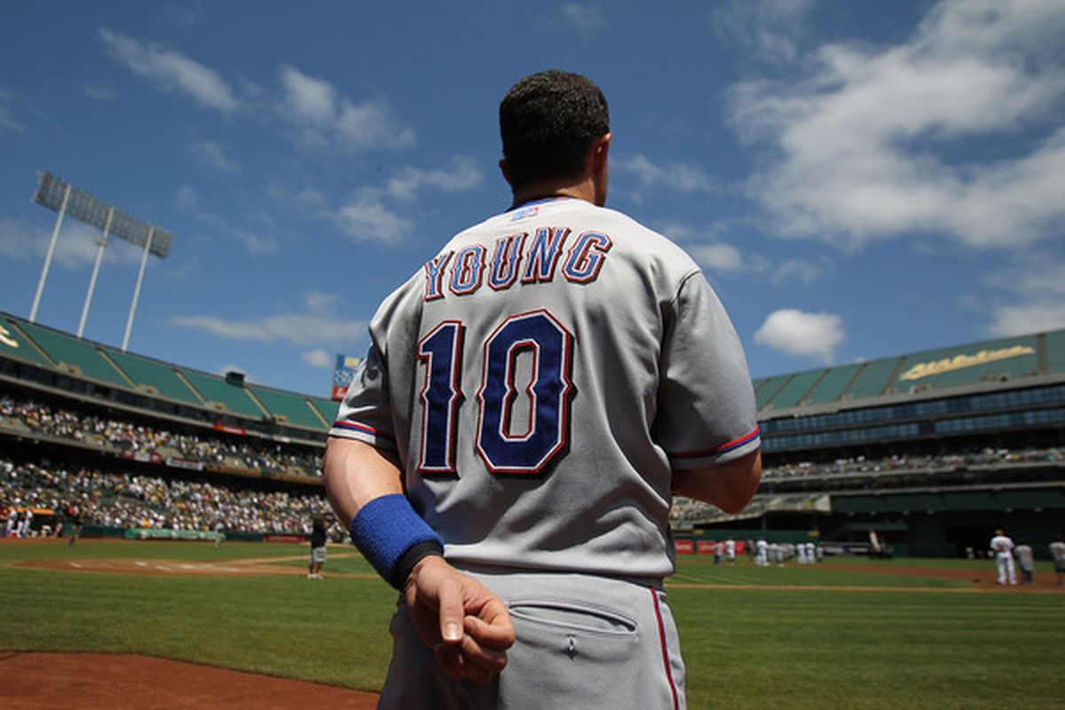 OAKLAND CA - AUGUST 8:  Michael Young #10 of the Texas Rangers looks on against the Oakland Athletics during an MLB game at the Oakland-Alameda County on August 8 2010 in Oakland California. (Photo by Jed Jacobsohn/Getty Images)