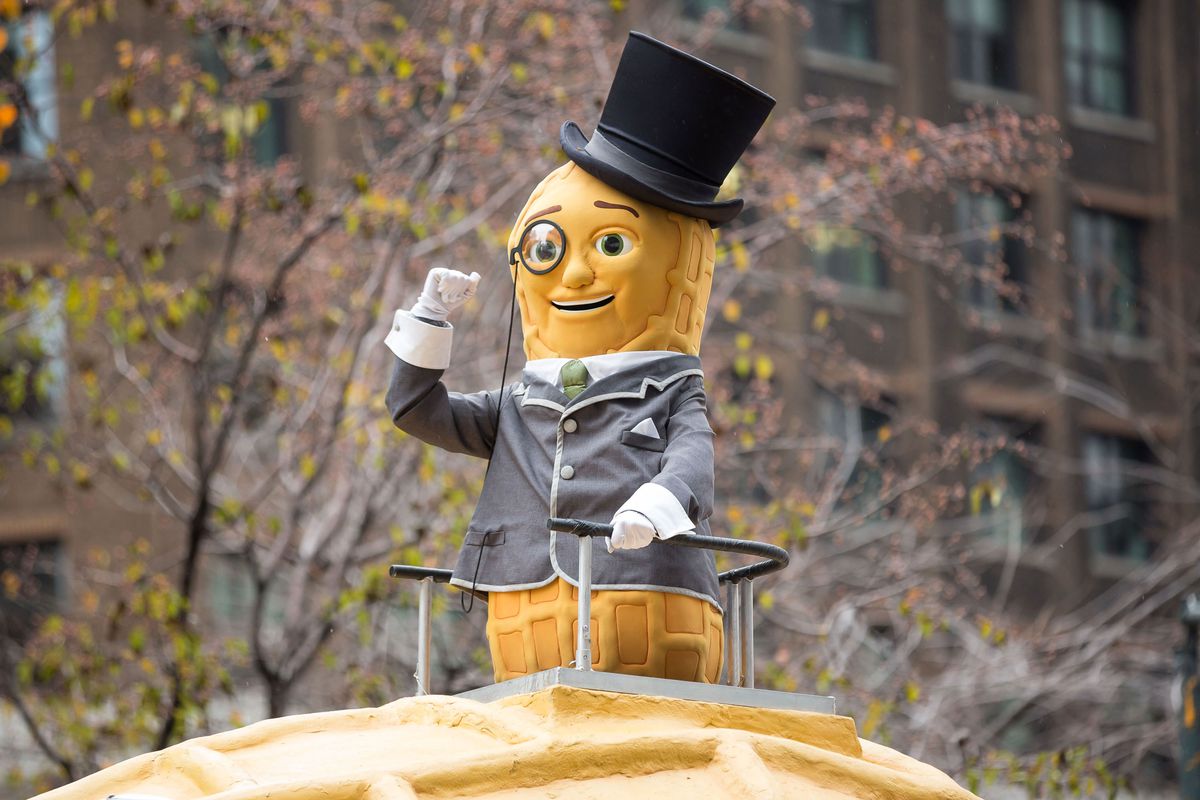 Planters’ Mr. Peanut mascot standing on a Nutmobile float in a parade.