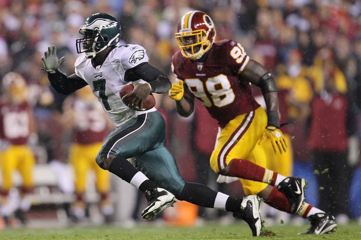 LANDOVER MD - NOVEMBER 15:  Michael Vick #7 of the Philadelphia Eagles makes a break past Brian Orakpo #98 of the Washington Redskins on November 15 2010 at FedExField in Landover Maryland.  (Photo by Chris McGrath/Getty Images)