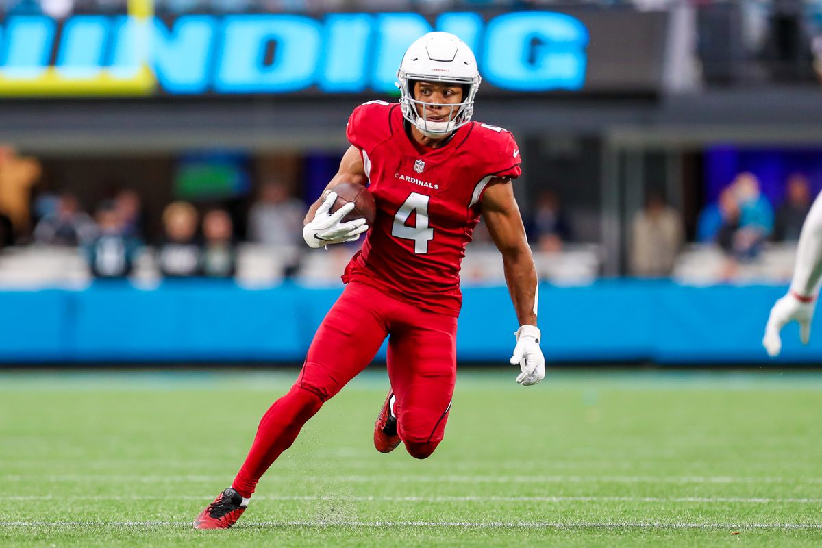 Rondale Moore (4) of the Arizona Cardinals runs the ball after making a catch during a football game between the Carolina Panthers and the Arizona Cardinals on October 2, 2022, at Bank of America Stadium in Charlotte, NC.