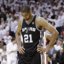The San Antonio Spurs' Tim Duncan (21) walks off the court after Game 7 of the NBA basketball championship against the Miami Heat, early Friday morning , June 21, 2013, in Miami. The Miami Heat defeated the San Antonio Spurs 95-88 to win their second straight NBA championship. 