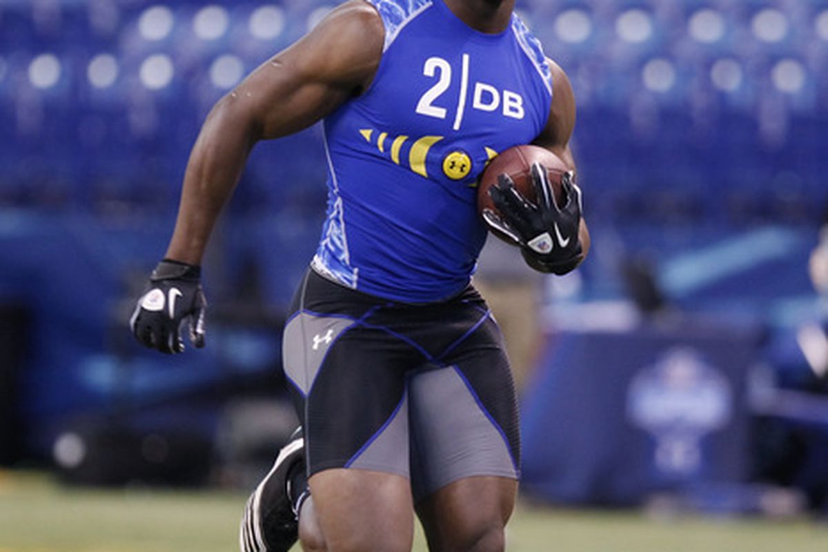 Defensive back Prince Amukamara of Nebraska runs with the football during the 2011 NFL Scouting Combine at Lucas Oil Stadium.
