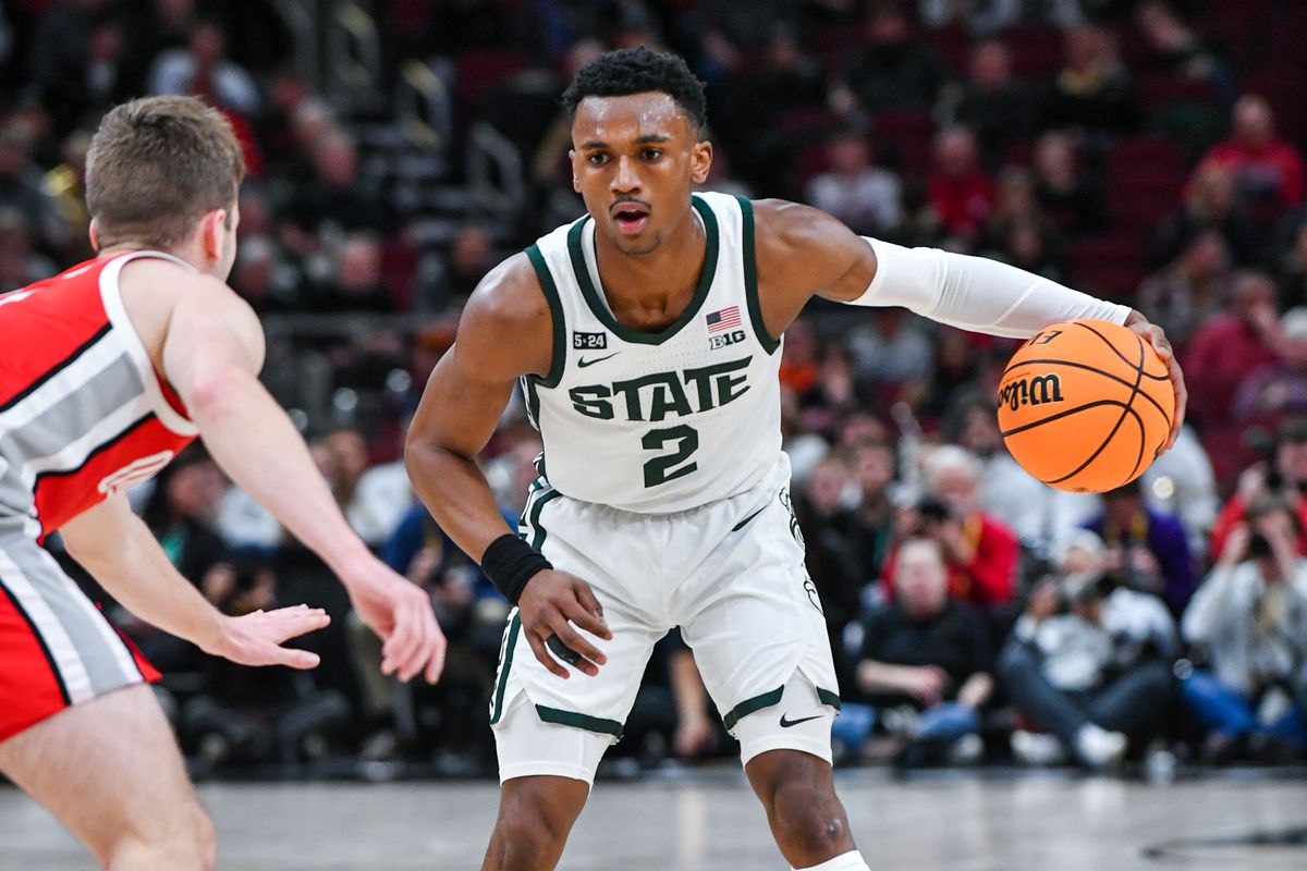 Tyson Walker #2 of the Michigan State Spartans dribbles the ball against Sean McNeil #4 of the Ohio State Buckeyes during the first half of a Big Ten Men’s Basketball Tournament Quarterfinals game at United Center on March 10, 2023 in Chicago, Illinois.