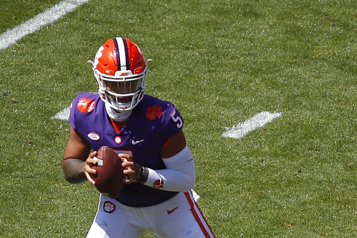 D.J. Uiagalelei of the Clemson Tigers rolls out to pass during the second half of the Clemson Orange and White Spring Game at Memorial Stadium on April 3, 2021 in Clemson, South Carolina.