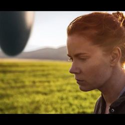 Amy Adams plays a linguist attempting to communicate with aliens in a spaceship (shown in the distance to her left) in the new film "Arrival," which poses interesting questions about language and communication.
