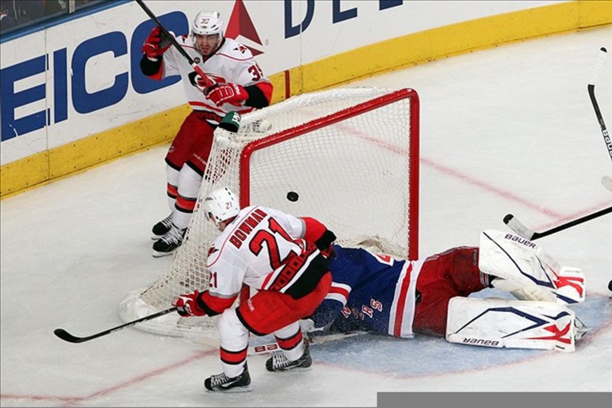 Mar 13 2012; New York, NY, USA;  Carolina Hurricanes left wing Drayson Bowman (21) scores as New York Rangers goalie Martin Biron (43) misses the save during the second period at Madison Square Garden.  Mandatory Credit: Anthony Gruppuso-US PRESSWIRE