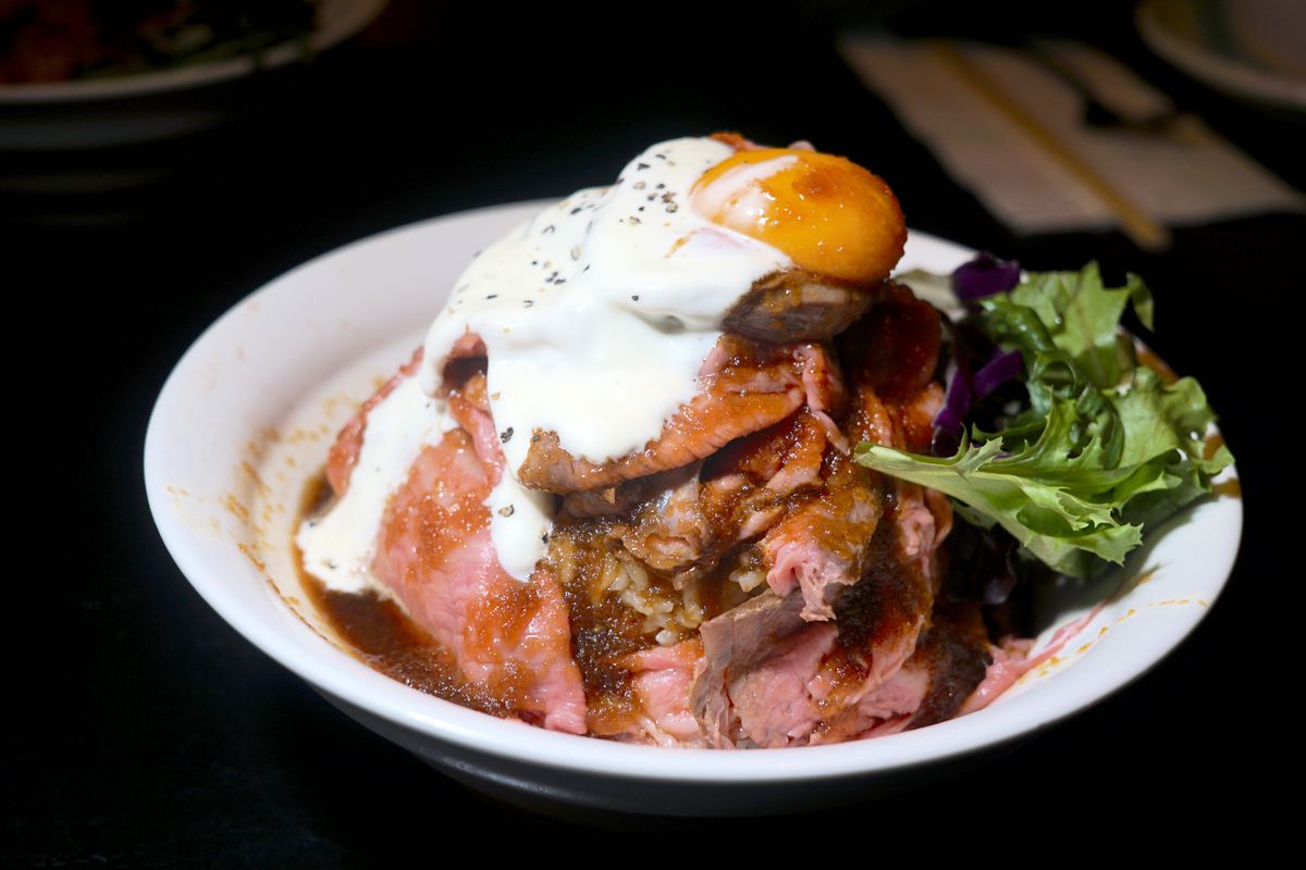 Sliced roasted beef topped with yogurt sauce and raw egg yolk at Red Rock in LA.