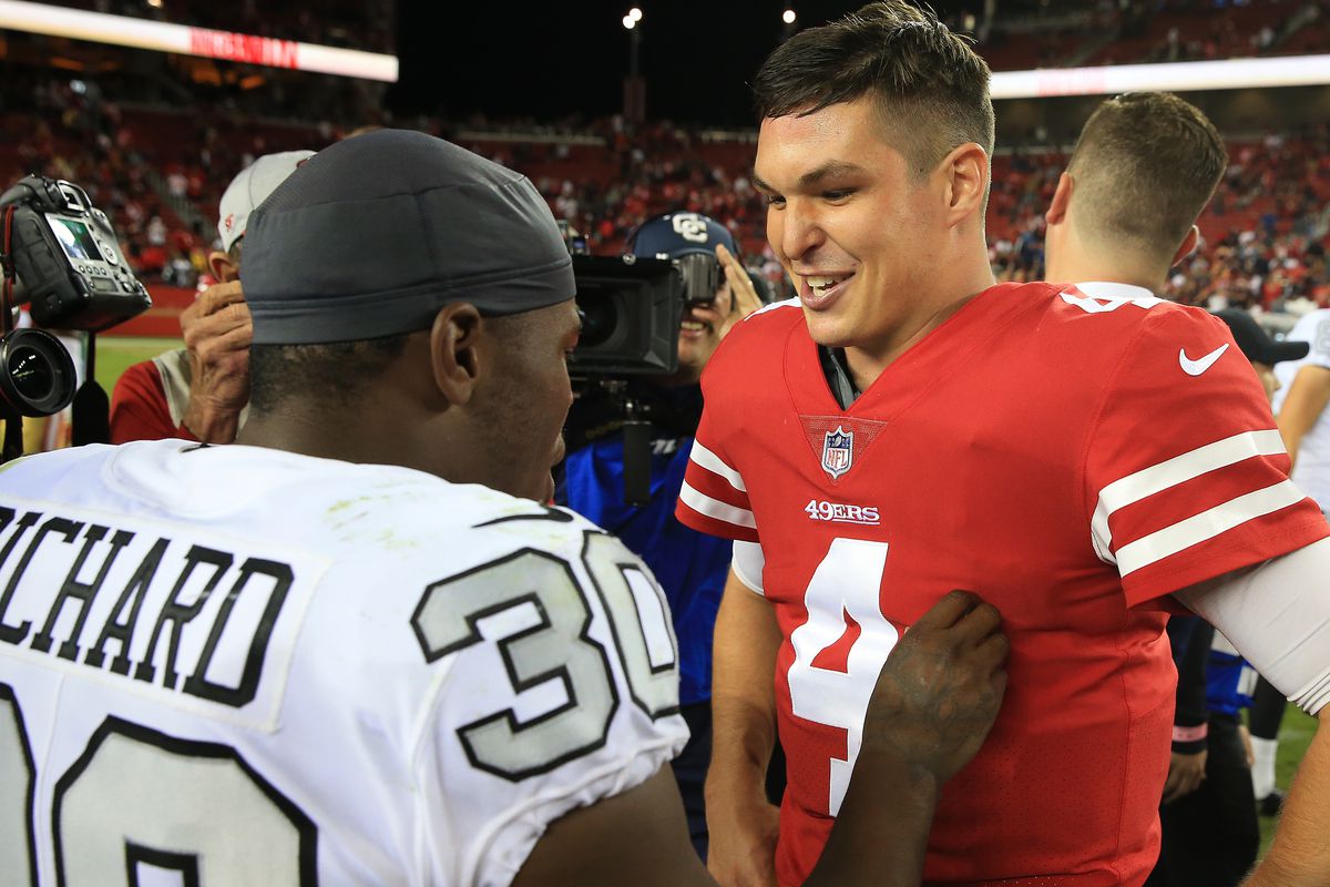 Nick Mullens smiles and talks with Jalen Richard