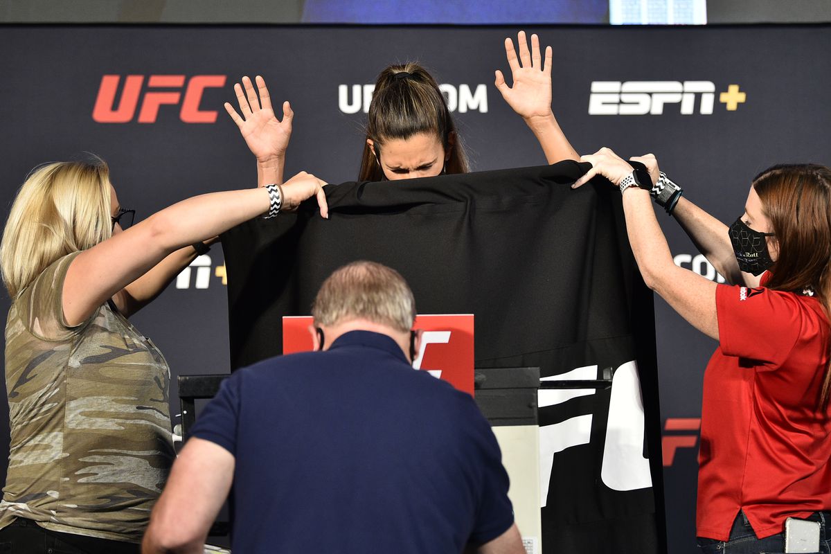Cortney Casey attempts to make weight during the UFC weigh-in at UFC APEX on June 19, 2020 in Las Vegas, Nevada.