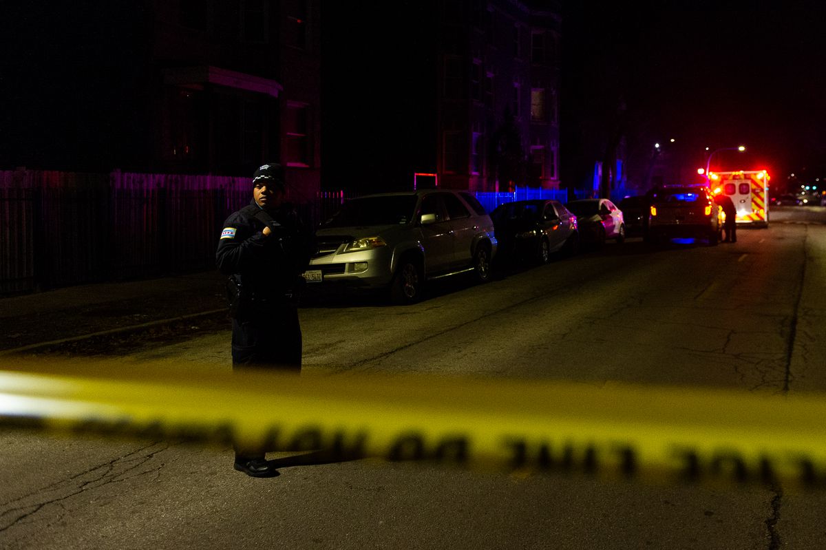 Police and EMS respond the the scene where multiple people were shot, Monday morning in the 5600 block of South Princeton, in the Englewood neighborhood. | Tyler LaRiviere/Sun-Times