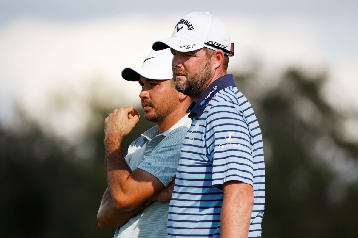 Jason Day of Australia and Marc Leishman of Australia look on over the ninth green during the second round of the QBE Shootout at Tiburon Golf Club on December 11, 2021 in Naples, Florida.