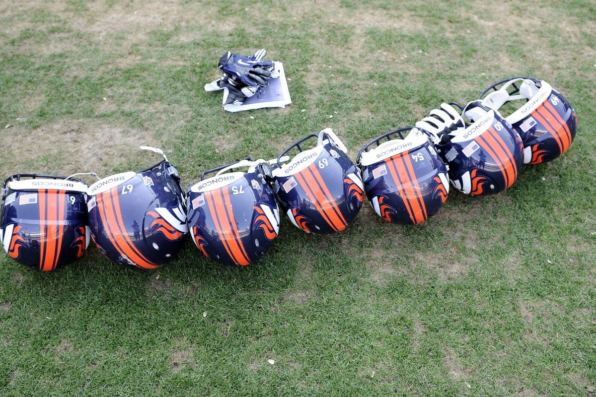 August 4, 2012; Englewood, CO, USA; General view of Denver Broncos helmets following training camp drills at Sports Authority Field. Mandatory Credit: Ron Chenoy-US PRESSWIRE