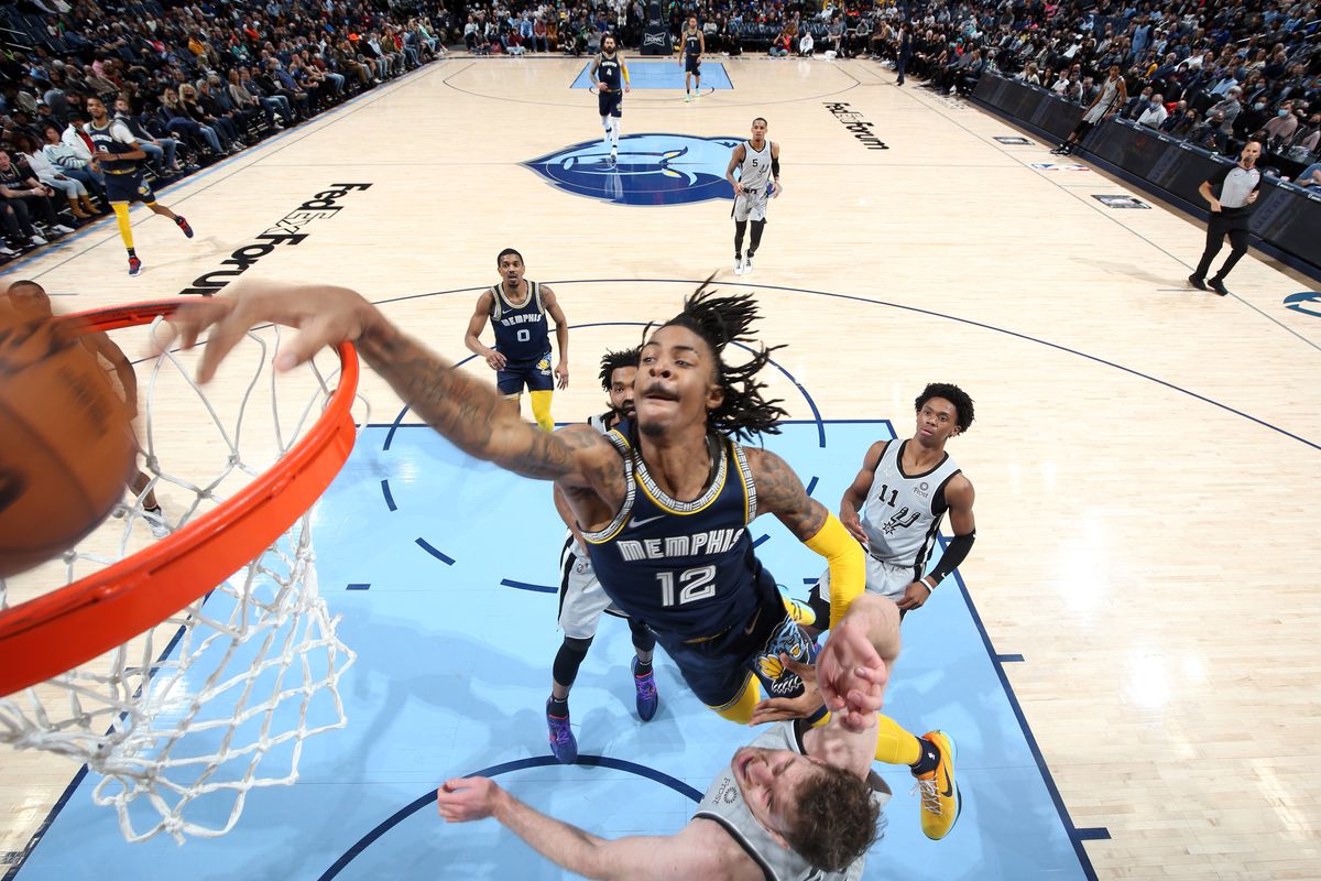 Ja Morant #12 of the Memphis Grizzlies dunks the ball during the game against the San Antonio Spurs on February 28, 2022 at FedExForum in Memphis, Tennessee.
