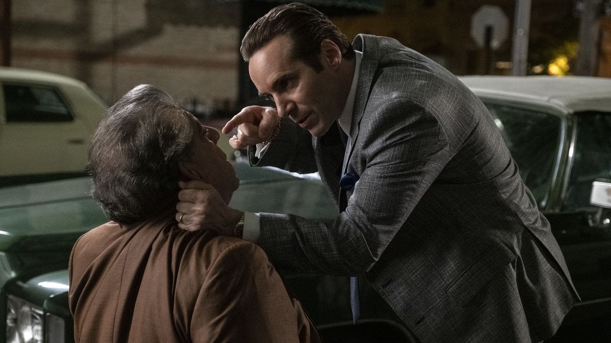 Alessandro Nivola as Dickie Moltisanti holds Joey Coco Diaz by the neck and threatens him in The Many Saints of Newark