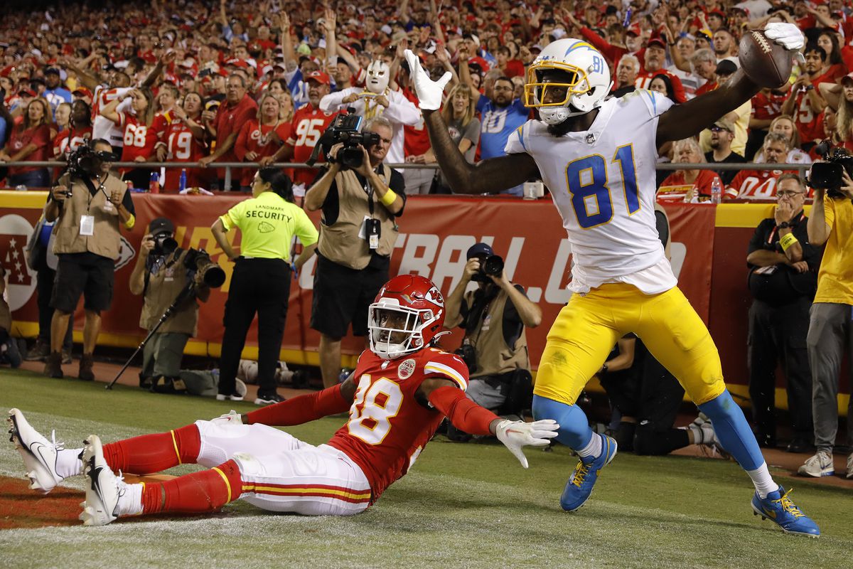 Mike Williams #81 of the Los Angeles Chargers celebrates after catching the ball in front of L’Jarius Sneed #38 of the Kansas City Chiefs for a touchdown during the third quarter at Arrowhead Stadium on September 15, 2022 in Kansas City, Missouri.