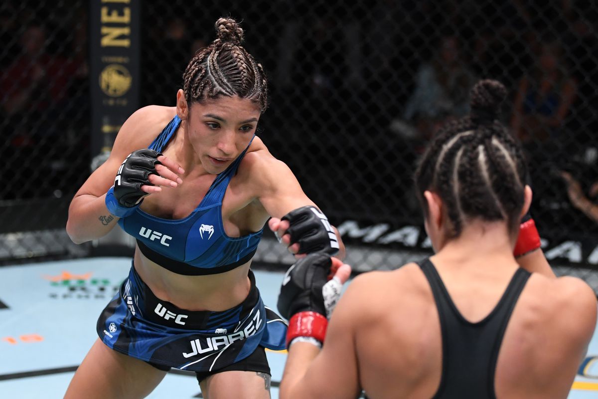 In this UFC handout, (L-R) Silvana Juarez of Argentina battles Loopy Godinez in their women’s strawweight bout during the UFC Fight Night event at UFC APEX on October 09, 2021 in Las Vegas, Nevada.