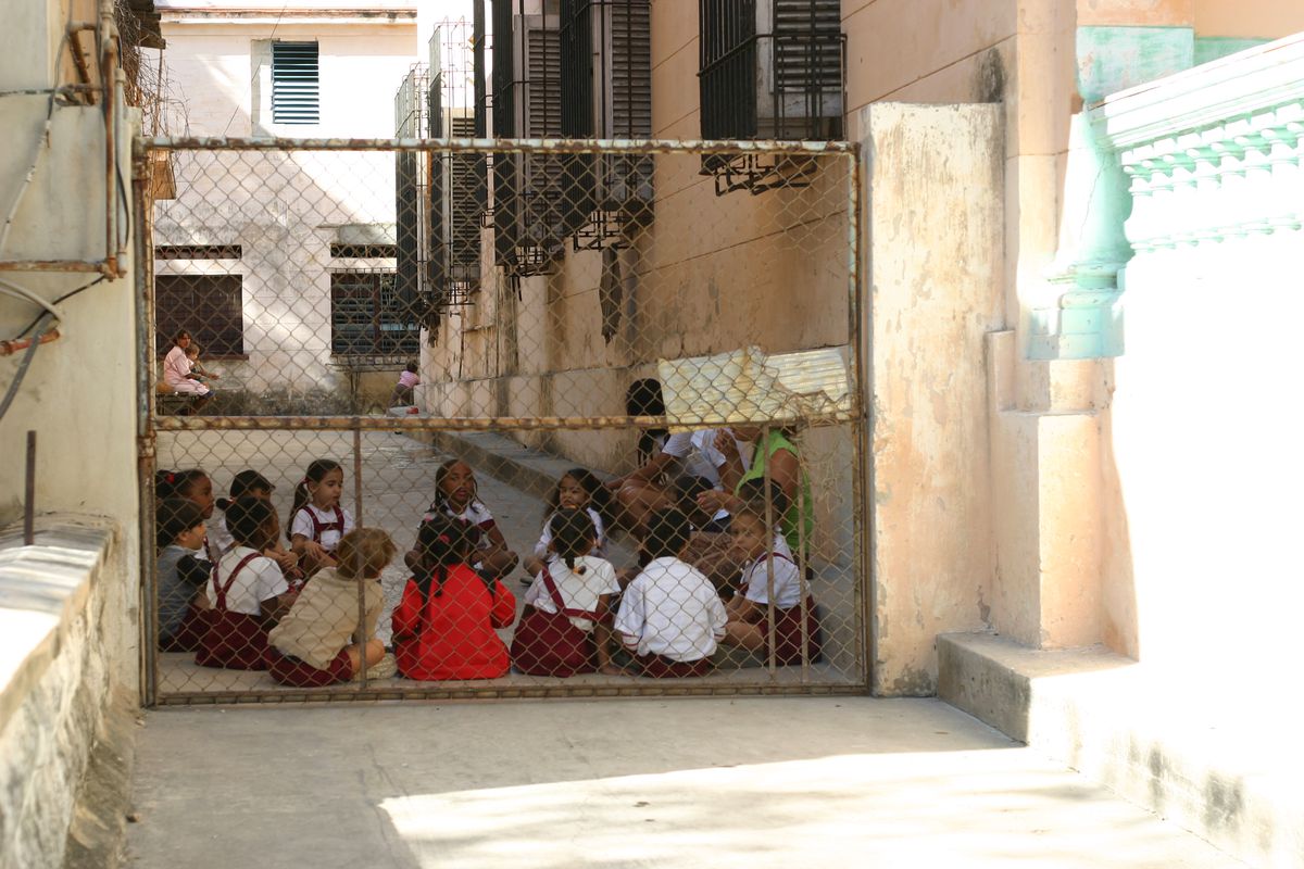 School children gather for an outdoor lesson in Havana