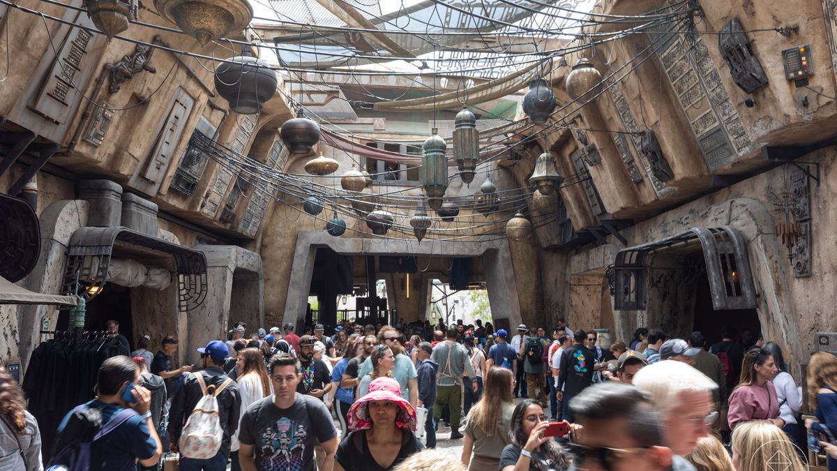 A view of the marketplace at Star Wars: Galaxy’s Edge on opening day in Anaheim, California. Moroccan-inspired lighting hangs overhead, mixed with technical baubles from the Star Wars universe.