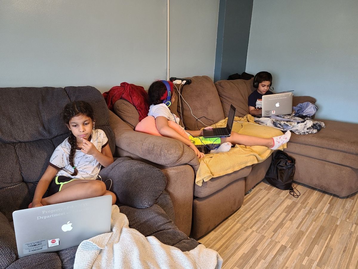 Three of Lilah Mejia’s children learn remotely from her apartment on the Lower East Side last fall.