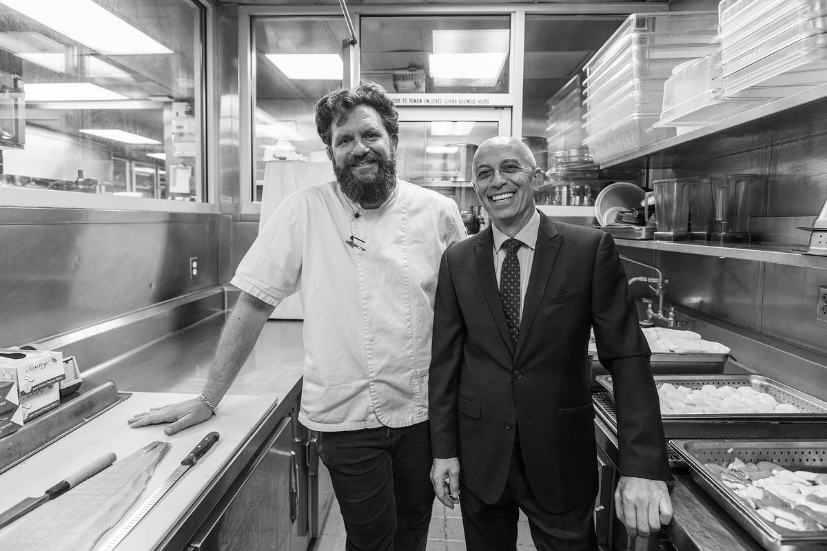 Providence restaurant owners/partners Michael Cimarosti and partner Donato Botto stand next to each other.