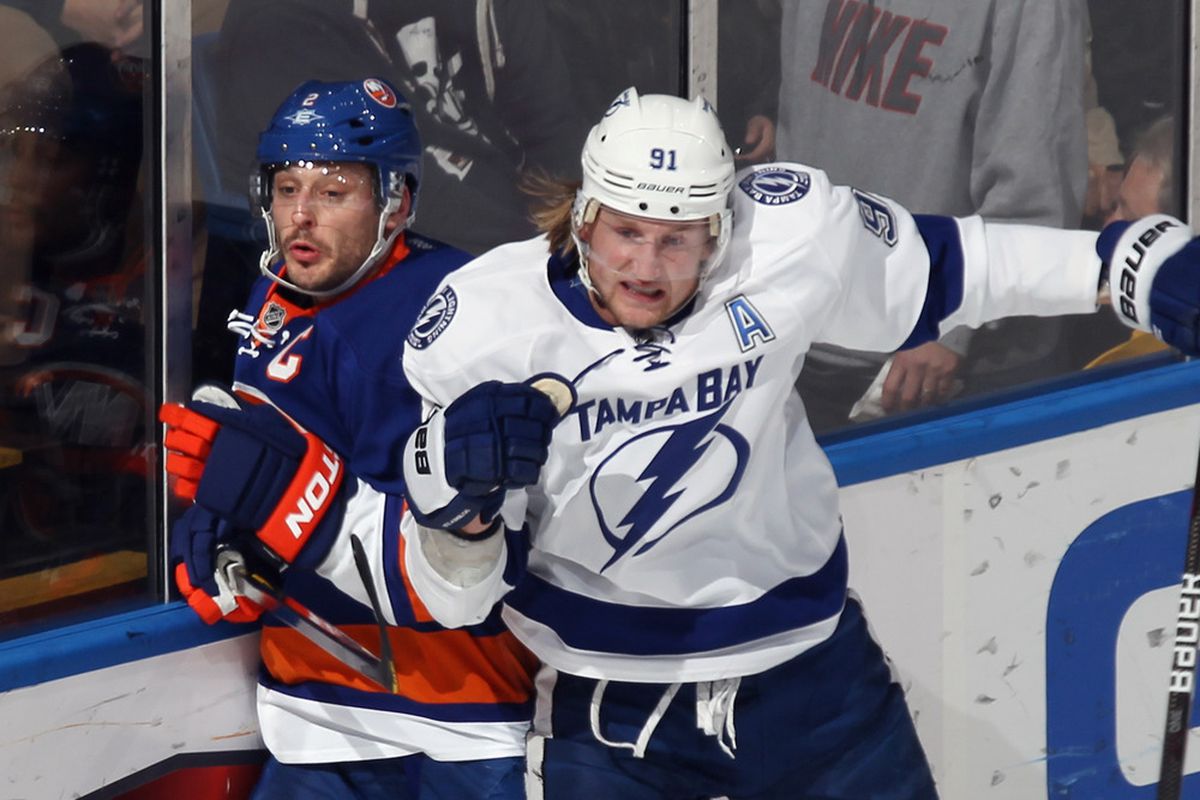 UNIONDALE, NY - DECEMBER 06: Steven Stamkos #91 of the Tampa Bay Lightning steps into Mark Streit #2 of the New York Islanders at the Nassau Veterans Memorial Coliseum on December 6, 2011 in Uniondale, New York.  (Photo by Bruce Bennett/Getty Images)