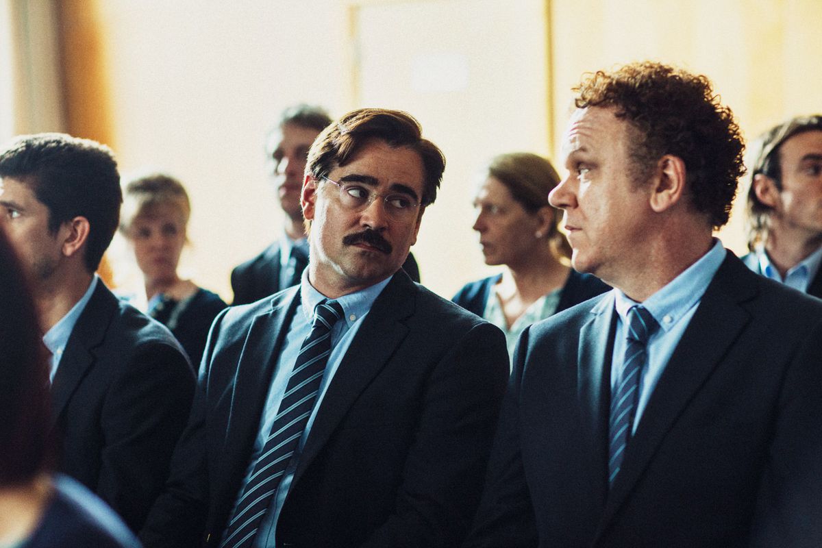 Colin Farrell and John C. Reilly seated side by side in The Lobster.