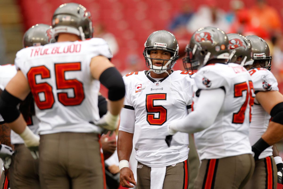 TAMPA, FL - SEPTEMBER 25:  Josh Freeman #5 of the Tampa Bay Buccaneers talks to teammates before playing against the Atlanta Falcons at Raymond James Stadium on September 25, 2011 in Tampa, Florida.  (Photo by Mike Ehrmann/Getty Images)