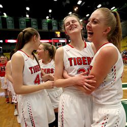 Hurricane's Hailey Homer sighs and Alexa Christensen cheers after Homer made a game-winning penalty shot in the last 2.2 seconds of the 4A semifinal girls basketball game against Lehi at the UCCU Center in Orem on Friday, March 2, 2018. Hurricane won 43-42.