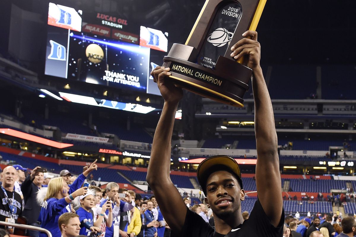 Apr 6, 2015; Indianapolis, IN, USA; Duke Blue Devils forward Amile Jefferson hoists the national championship trophy after defeating the Wisconsin Badgers the 2015 NCAA Men's Division I Championship game at Lucas Oil Stadium. 