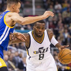 Utah guard Shelvin Mack (8) drives against Golden State guard Stephen Curry (30) during the first half of an NBA basketball game in Salt Lake City on Thursday, Dec. 8, 2016.