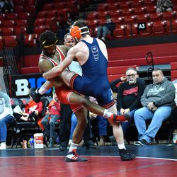 Nebraska’s Chad Red Jr. (left) sweeps the leg of Illinois’ Dylan Duncan in a dual on Feb. 13, 2022 at the Bob Devaney Sports Center.