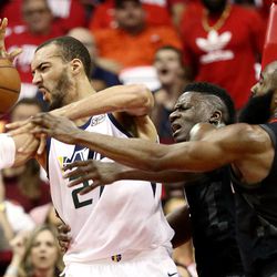 Utah Jazz center Rudy Gobert (27) is fouled by Houston Rockets guard James Harden (13) as the Utah Jazz and the Houston Rockets play game two of the NBA playoffs at the Toyota Center in Houston on Wednesday, May 2, 2018.