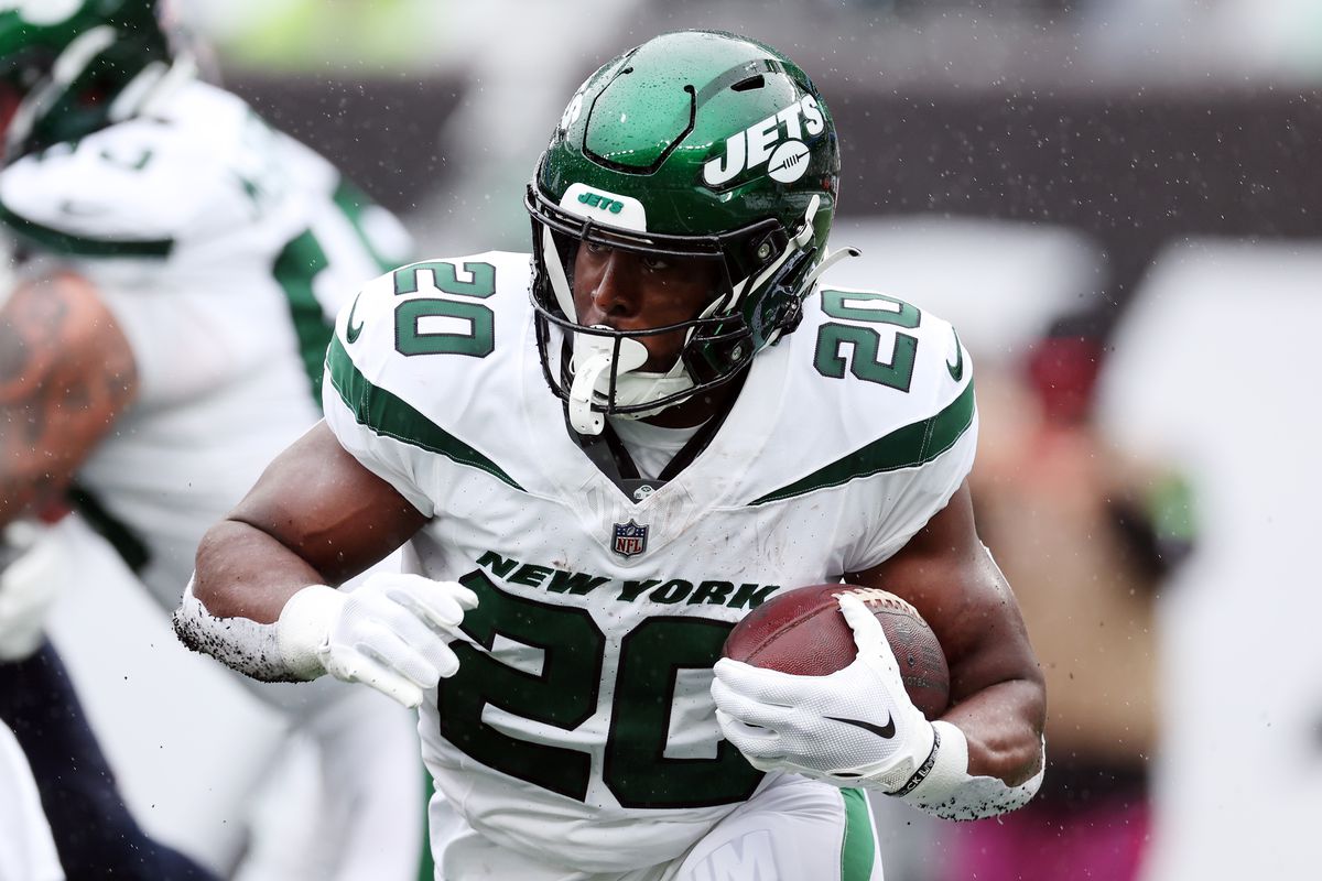 Breece Hall #20 of the New York Jets runs with the ball against the New England Patriots in the first half at MetLife Stadium on September 24, 2023 in East Rutherford, New Jersey.