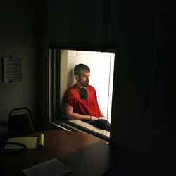 Ex-marine Walter Smith sits alone in a holding cell after being sentenced for the murder of Nicole Speirs, his girlfriend and mother of his children, in 3rd District Court in Tooele on Oct. 9, 2007. 