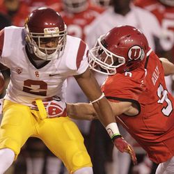 Southern California wide receiver Robert Woods (2) carries the ball as he breaks a tackle from Utah linebacker Trevor Reilly (9) in the first quarter of an NCAA college football game Thursday, Oct. 4, 2012, in Salt Lake City.