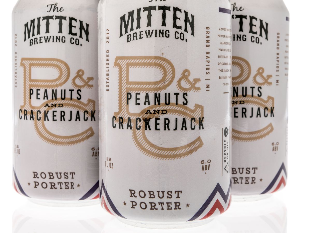 3 cans of Mitten Brewing Co. Peanuts and Crackerjack robust porter
