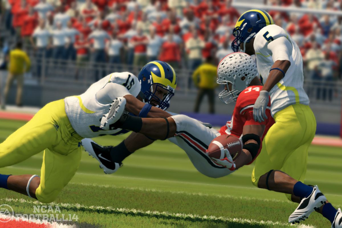 A Michigan football player applies a crunching hit to his Ohio State rival in EA Sports’ NCAA Football 14.