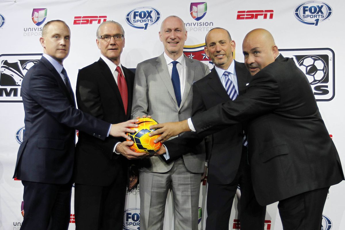 These photos are awkward enough without somebody forgetting that MLS is an adidas league and giving them a Nike ball.