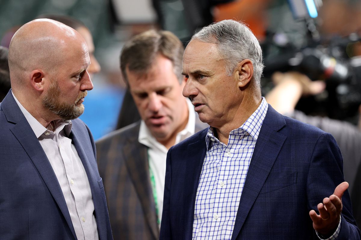 Major League Baseball Commissioner Rob Manfred talks with General manager James Click of the Houston Astros prior to Game One of the World Series between the Atlanta Braves and the Houston Astros at Minute Maid Park on October 26, 2021 in Houston, Texas.