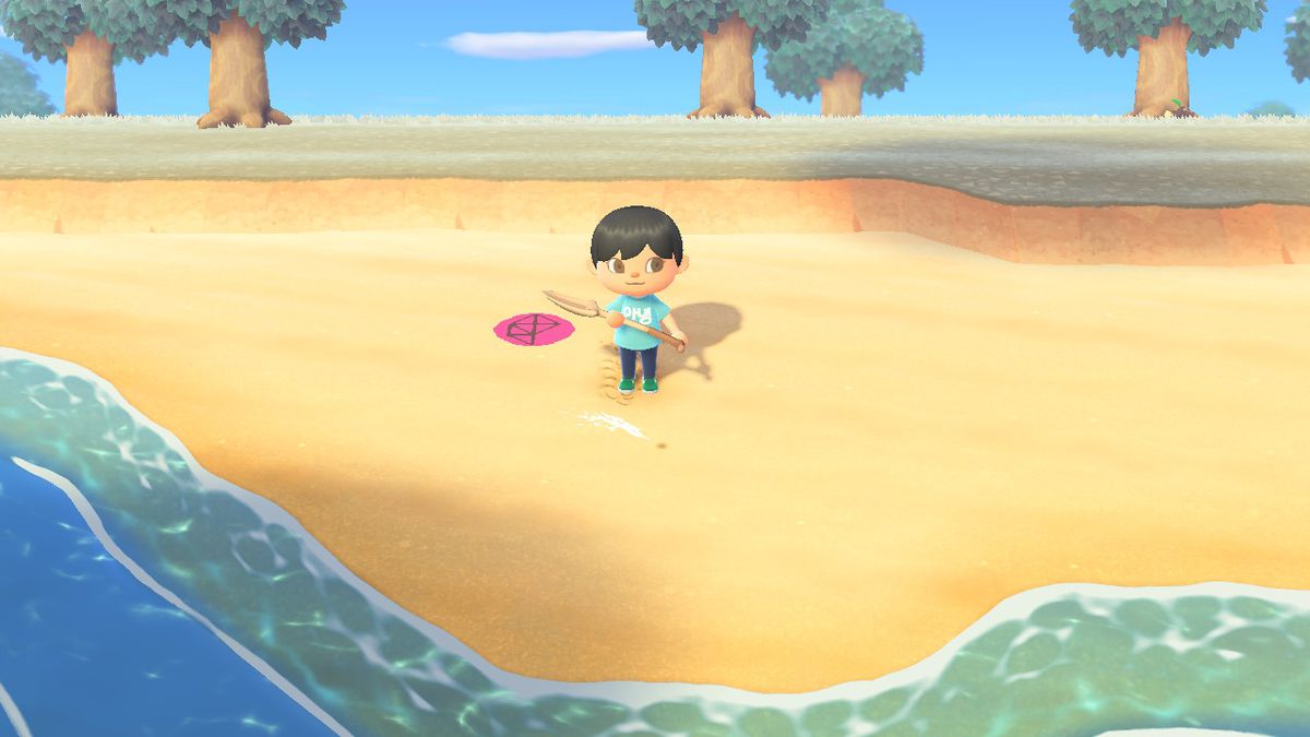 An Animal Crossing character stands on the beach in front of a digging spot with a shovel