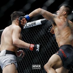 Alejandro Perez lands a left hook on Matthew Lopez at UFC on FOX 29 on Saturday at Gila River Arena in Glendale, Ariz.