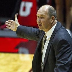 Brigham Young head coach Jeff Judkins argues a call during an NCAA women's college basketball game in Salt Lake City on Saturday, Dec. 10, 2016. Utah defeated rival Brigham Young 77-60.