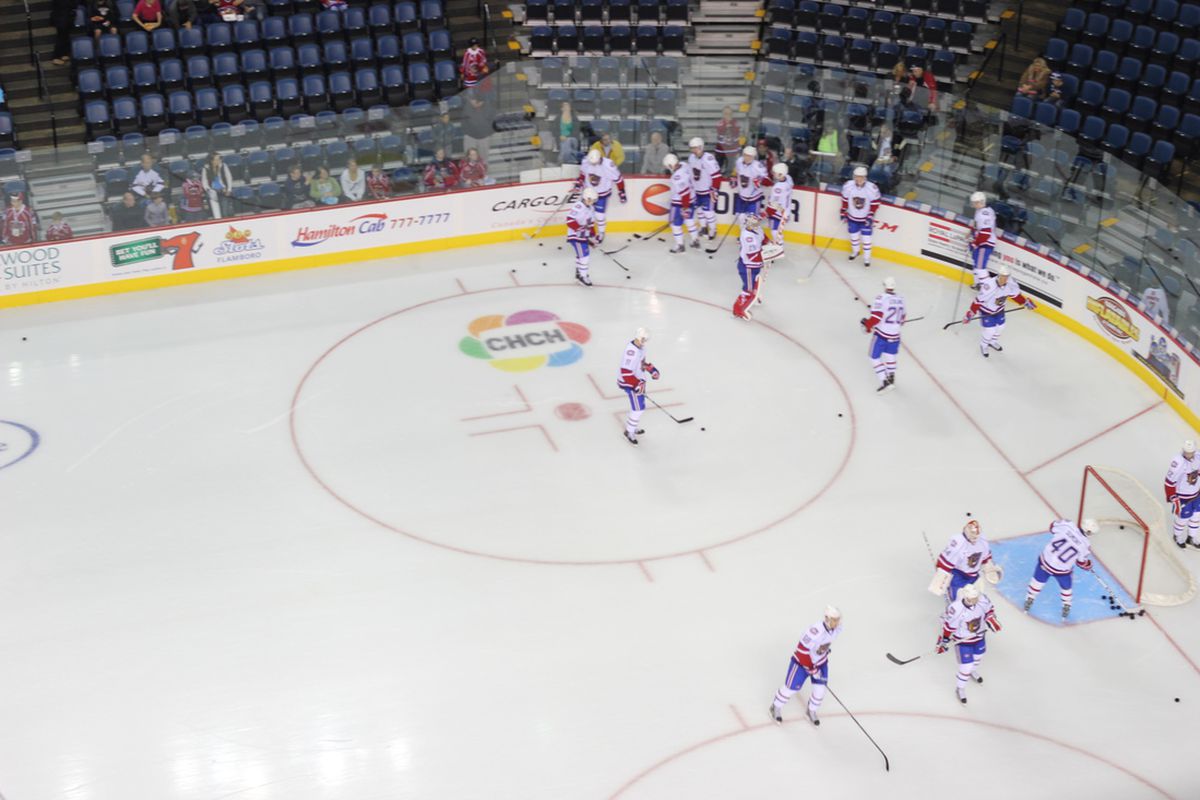 Bulldogs players warm up just prior to puck drop on opening night at Copps Coliseum.