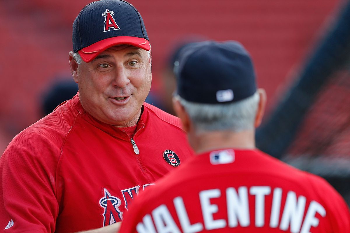 FOXBORO, MA - AUGUST 21: Mike Scioscia #14 of the Los Angeles Angels chats with Bobby Valentine #25 of the Boston Red Sox before a game at Fenway Park on August 21, 2012 in Boston, Massachusetts.  (Photo by Jim Rogash/Getty Images)