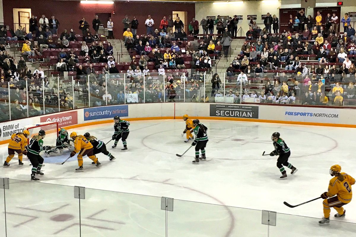 The Gophers battle for the puck in an eventual 3-0 victory over North Dakota.