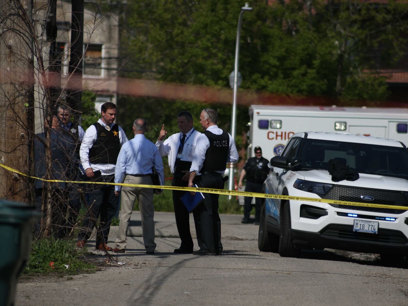 Chicago police investigate the scene where two officers were shot May 16, 2021, in Lawndale.