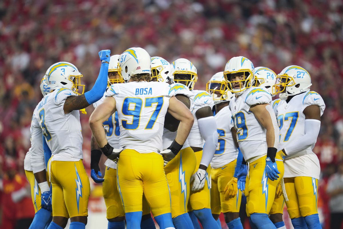 Los Angeles Chargers huddle up against the Kansas City Chiefs at GEHA Field at Arrowhead Stadium on September 15, 2022 in Kansas City, Missouri.